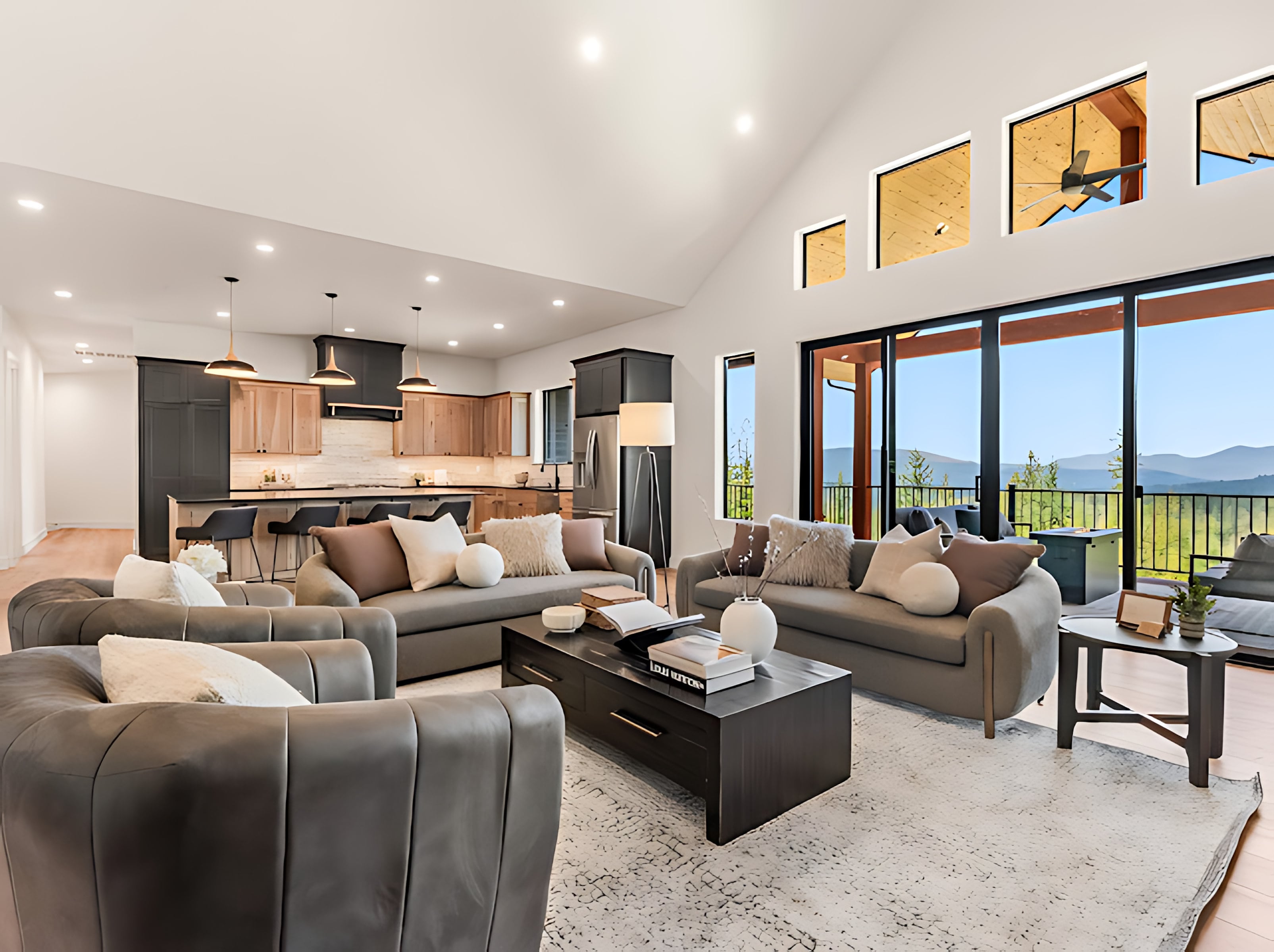 Open great room and kitchen with clerestory and mountain-view windows
